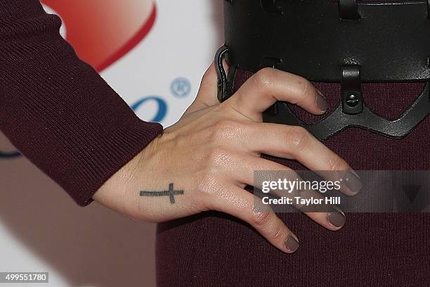 Demi Lovato, nail detail, tattoo detail, attends 106.1 KISS FM's 2015 Jingle Ball at American Airlines Center on December 1, 2015 in Dallas, Texas.