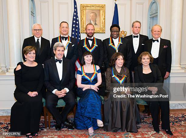 The group photo is taken after the dinner. Top row, from left to right are Kennedy Center Chairman David M. Rubenstein, Tom Hanks, Sting, Al Green,...