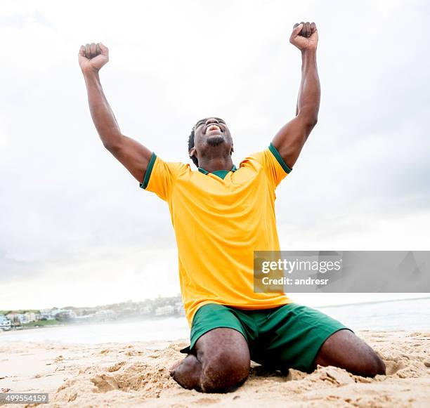 man celebrating a goal - a brazil supporter stockfoto's en -beelden