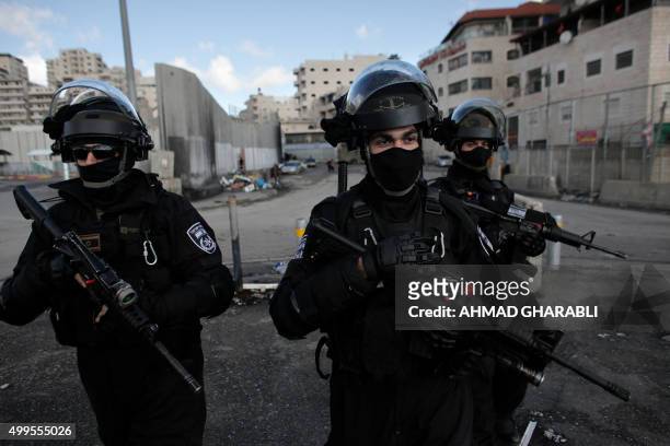 Israeli security forces stand guard in the east Jerusalem Shuafat refugee camp ahead of a planned demolition of a home of a Palestinian who carried...