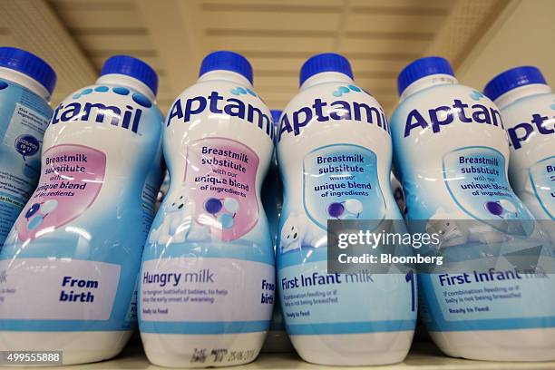 Bottles of Aptamil formula baby milk, manufactured by Danone SA, stand on display at the Tesco Basildon Pitsea Extra supermarket, operated by Tesco...