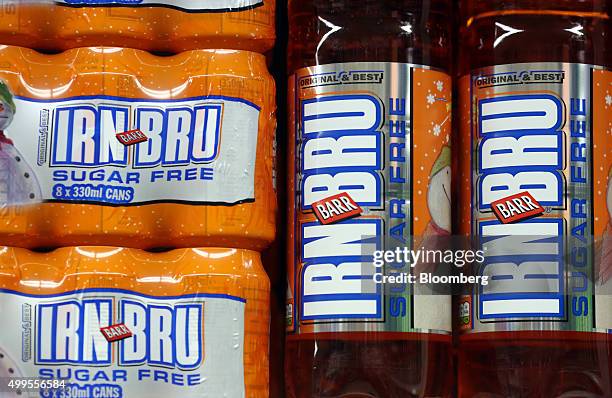 Cans and bottles of Irn-Bru sugar free soft drink, manufactured by A.G. Barr Plc, stand on a shelf at the Tesco Basildon Pitsea Extra supermarket,...