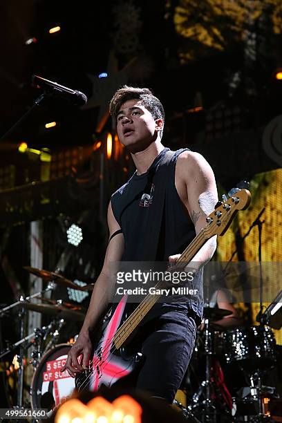 Calum Hood of 5 Seconds of Summer performs in concert during the iHeart Radio 106.1 KISS FM Jingle Ball at the American Airlines Center on December...