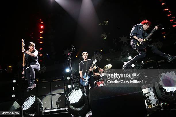 Calum Hood, Luke Hemmings, Ashton Irwin and Michael Clifford of 5 Seconds of Summer perform in concert during the iHeart Radio 106.1 KISS FM Jingle...