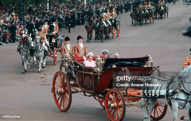 Queen Elizabeth ll and Prince Philip, Duke of Edinburgh ride in an open carriage during the Silver Jubilee celebrations on June 07, 1977 in London,...