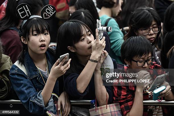 Music fans wait at the red carpet of the 2015 Mnet Asian Music Awards , the leading K-pop awards ceremony, in Hong Kong on December 2, 2015. AFP...