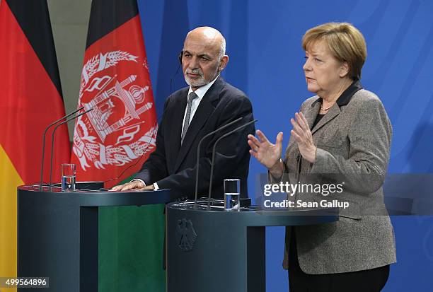 German Chancellor Angela Merkel and Afghan President Ashraf Ghani speak to the media following talks at the Chancellery on December 2, 2015 in...