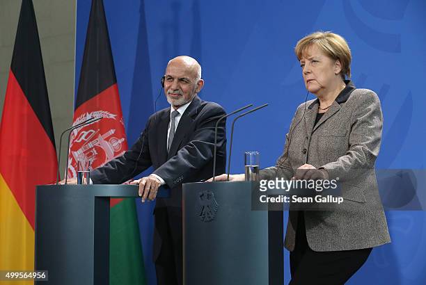 German Chancellor Angela Merkel and Afghan President Ashraf Ghani speak to the media following talks at the Chancellery on December 2, 2015 in...
