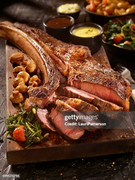 tomahawk, the ultimate steak - tomahawk stock pictures, royalty-free photos & images