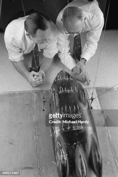 British speed record breaker Donald Campbell and chief mechanic Leo Villa testing a model of the Bluebird-Proteus CN7 land speed record-breaking car...