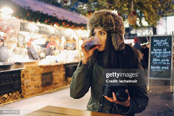 winter portrait of a smiling young woman photographer - budapest new year stock pictures, royalty-free photos & images