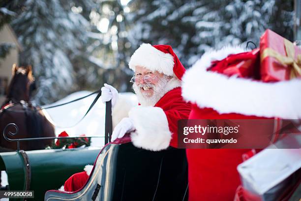santa claus in his sleigh at north pole - sleigh stock pictures, royalty-free photos & images