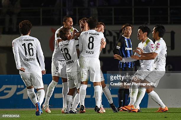 Sho Sasaki of Sanfrecce Hiroshima celebrates the 2nd goal with his team mates during the J.League 2015 Championship final 1st leg match between Gamba...