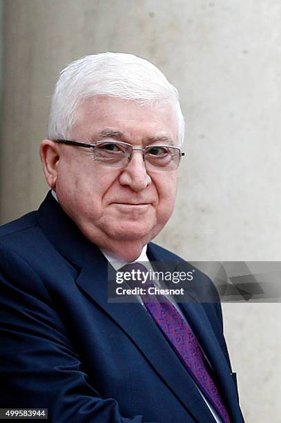 Iraq's President Fuad Masum poses prior to attend a meeting with French President Francois Hollande at the Elysee Presidential Palace on December 02,...