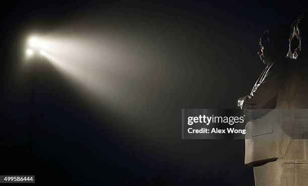 The statue is illuminated at the Martin Luther King, Jr. Memorial in dense fog during the early morning hours on December 2, 2015 in Washington, DC....