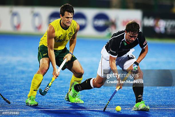 Matt Gohdes of Australia vies with Tobias Hauke Captain of Germany during the match between Australia and Germany on day six of The Hero Hockey...