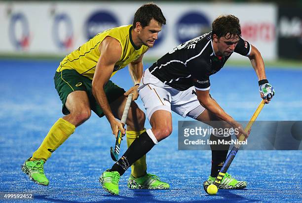 Matt Gohdes of Australia vies with Tobias Hauke Captain of Germany during the match between Australia and Germany on day six of The Hero Hockey...