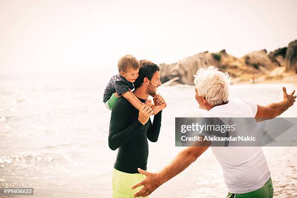 love and care through generations - grandpa son stock pictures, royalty-free photos & images