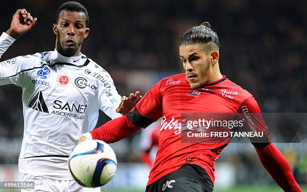 Guingamp's French defender Dorian Leveque vies with Reims' Cape Verdean forward Odair Fortes during the French L1 match between Guingamp and Reims at...