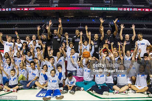 Players pose for pictures with Mexican Special Olympics athletes during the NBA Cares clinic at Arena Ciudad de Mexico on December 02, 2015 in Mexico...