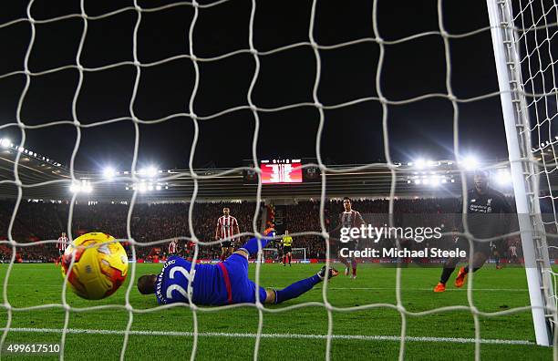 Daniel Sturridge of Liverpool beats goalkeeper Maarten Stekelenburg of Southampton to score their second goal during the Capital One Cup quarter...