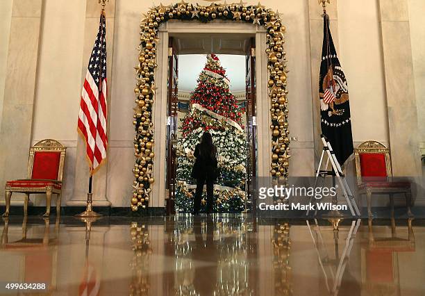 Decrorated 18' tree stands in the Blue Room during first lady Michelle Obama's preview of the 2015 holiday decor at the White House December 2, 2015...