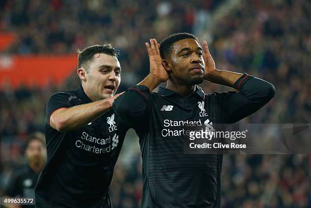 Jordon Ibe of Liverpool celebrates with Connor Randall as he scores their fifth goal during the Capital One Cup quarter final match between...