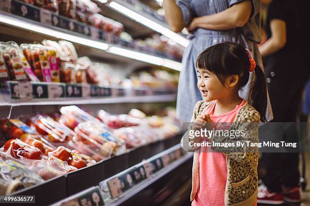 little girl shopping in supermarket with mom - woman shopping china stock pictures, royalty-free photos & images