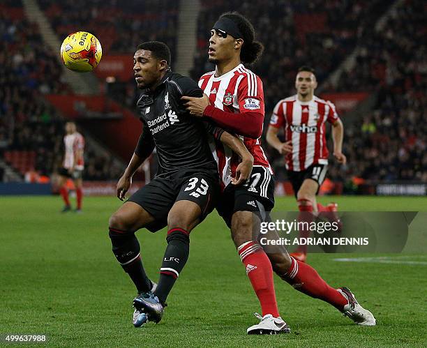 Liverpool's English midfielder Jordon Ibe vies with Southampton's Dutch defender Virgil van Dijk during the English League Cup quarter-final football...