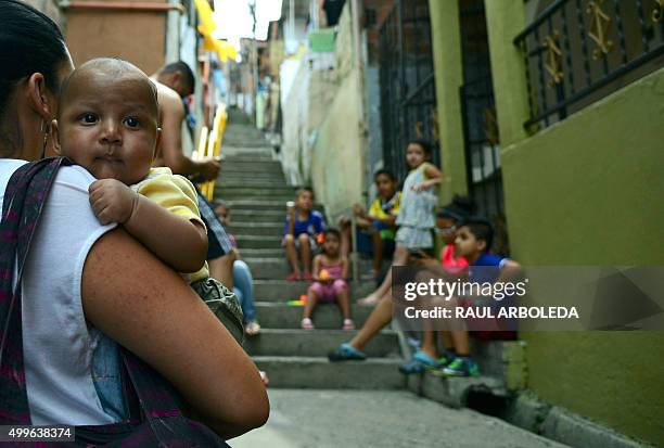 Children are seen at the Pablo Escobar neighborhood in Medellin, Colombia, on December 2, 2015. 22 years after his death, Escobar is still revered by...