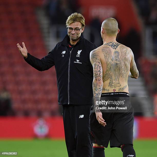 Jurgen Klopp manager of Liverpool shows his appreciation to Martin Skrtel at the end during the Capital One Cup Quarter Final match between...