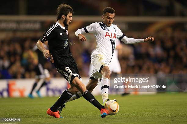 Dele Alli of Tottenham Hotspur in action with Badavi Guseynov of Qarabag during the UEFA Europa League match between Tottenham Hotspur FC and Qarabag...