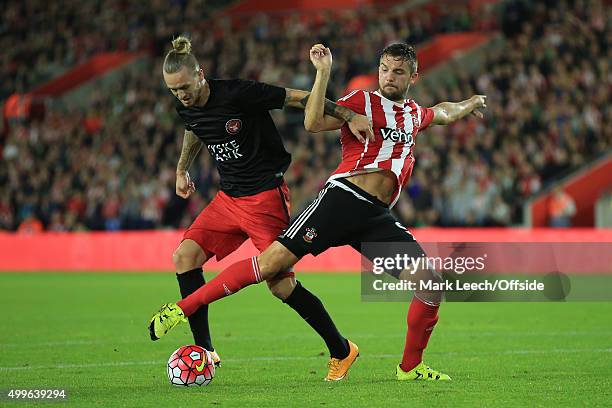 Jay Rodriguez of Southampton tangles with Kian Hansen of FC Midtjylland during the UEFA Europa League Play Off Round 1st Leg match between...