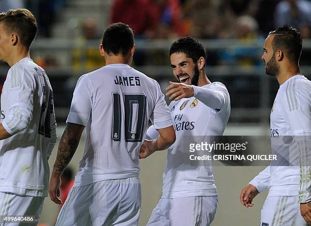 Real Madrid's midfielder Isco celebrates after scoring with Real Madrid's Colombian midfielder James Rodriguez during the Spanish Copa del Rey...
