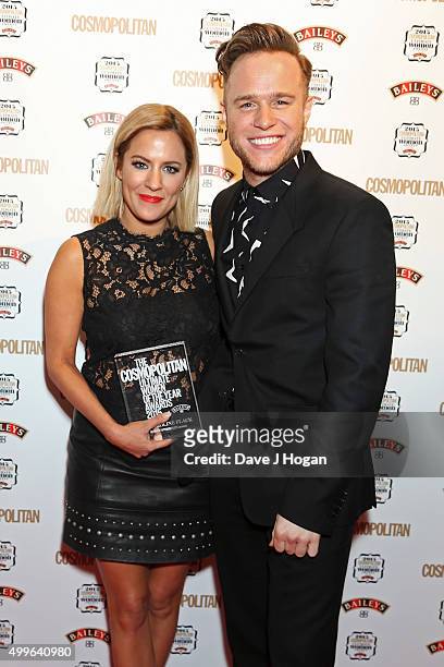 Caroline Flack and Olly Murs pose for a photo with the award for TV Personality during the Cosmopolitan Ultimate Women Of The Year Awards at One...