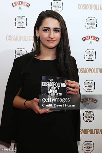 Meltem Avcil poses for a photo with the award for Campaigner during the Cosmopolitan Ultimate Women Of The Year Awards at One Mayfair on December 2,...