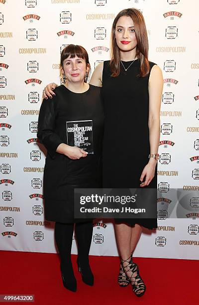 Abi Morgan and Wallis Day pose for a photo with the award for Game Changer during the Cosmopolitan Ultimate Women Of The Year Awards at One Mayfair...