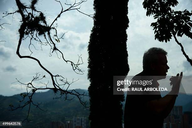 Jhon Jairo Velasquez, A.K.A "Popeye", visits the tomb of Colombian drug lord Pablo Escobar at the Montesacro cemetery in Medellin, Antioquia...