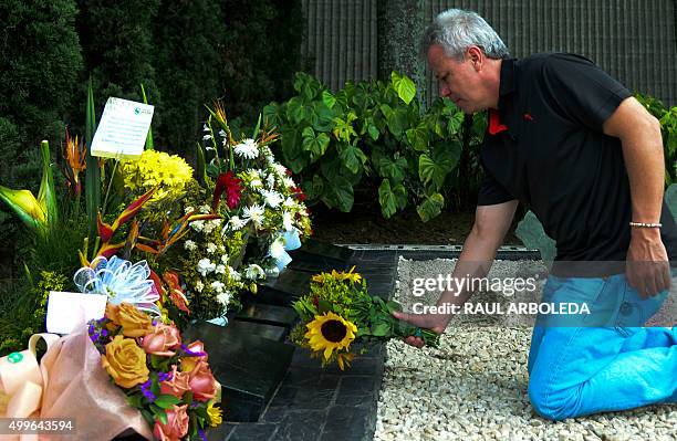 Jhon Jairo Velasquez, A.K.A "Popeye", visits the tomb of Colombian drug lord Pablo Escobar at the Montesacro cemetery in Medellin, Antioquia...