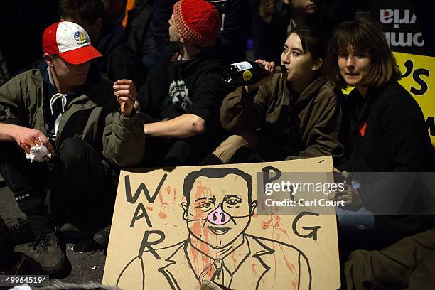 Demonstrators protest against British airstrikes against Islamic State targets in Syria outside Parliament on December 2, 2015 in London, England....