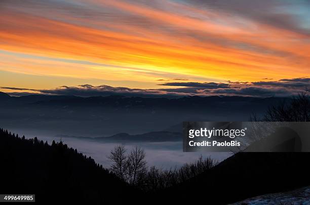 the dawn of a new day in croce d'aune, belluno - croce d'aune stock pictures, royalty-free photos & images
