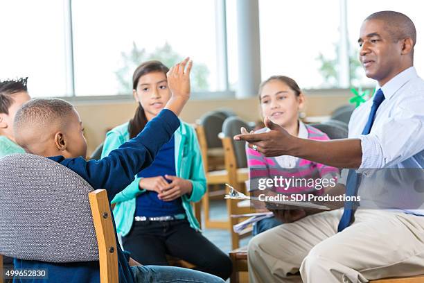 group of elementary students in tharapy or counseling session - child psychologist stock pictures, royalty-free photos & images