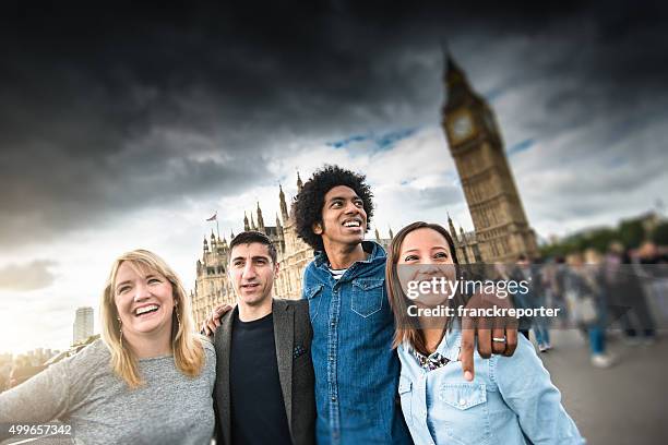 friends have fun in london at the big ben - clock tower stock pictures, royalty-free photos & images