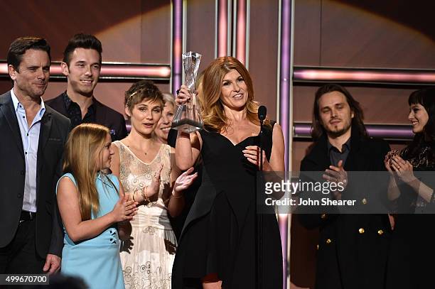 Actress Connie Britton and the cast of ABC's Nashville receive award onstage during the 2015 "CMT Artists of the Year" at Schermerhorn Symphony...