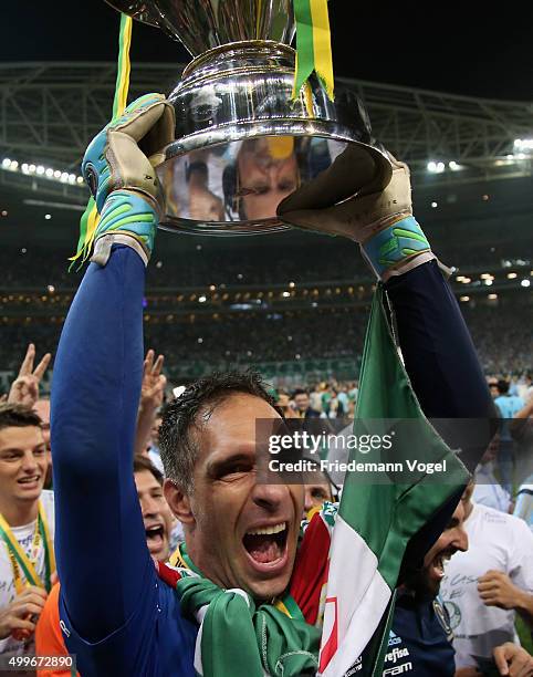 Fernando Prass of Palmeiras celebrates with the trophy after winning the match between Palmeiras and Santos for the Copa do Brasil 2015 Final at...