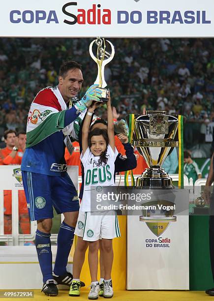 Fernando Prass of Palmeiras celebrates with the trophy after winning the match between Palmeiras and Santos for the Copa do Brasil 2015 Final at...