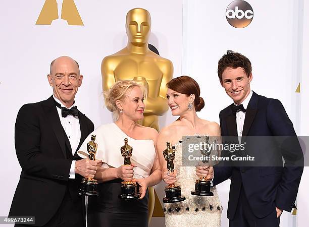 Actors J.K. Simmons, Patricia Arquette, Julianne Moore and Eddie Redmayne pose in the press room during the 87th Annual Academy Awards at Loews...