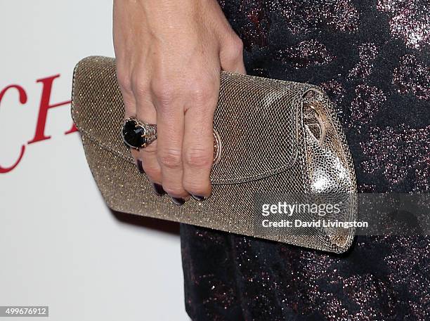 Actress Cheryl Hines, purse detail, attends the premiere of Unstuck's "Christmas Eve" at ArcLight Hollywood on December 2, 2015 in Hollywood,...