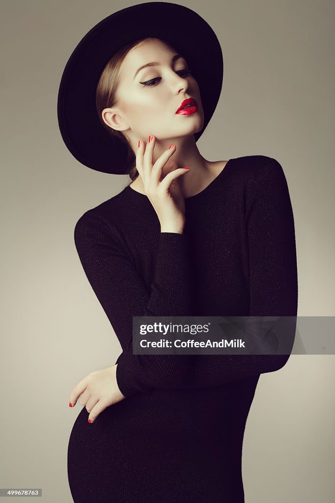 Young beautiful woman wearing retro hat