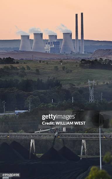 To go with Climate-warming-UN-COP21-Australia-coal,FEATURE by Madeleine Coorey A photo taken on November 18 shows coal being produced at an open-cut...